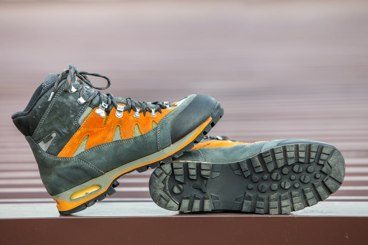 A pair of 6-inch leather trekking hiking winter boots.