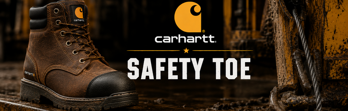 A brown Carhartt lace-up work boot with a black safety toe, shown in a rugged industrial setting with the Carhartt logo and 'SAFETY TOE' text overlaid.