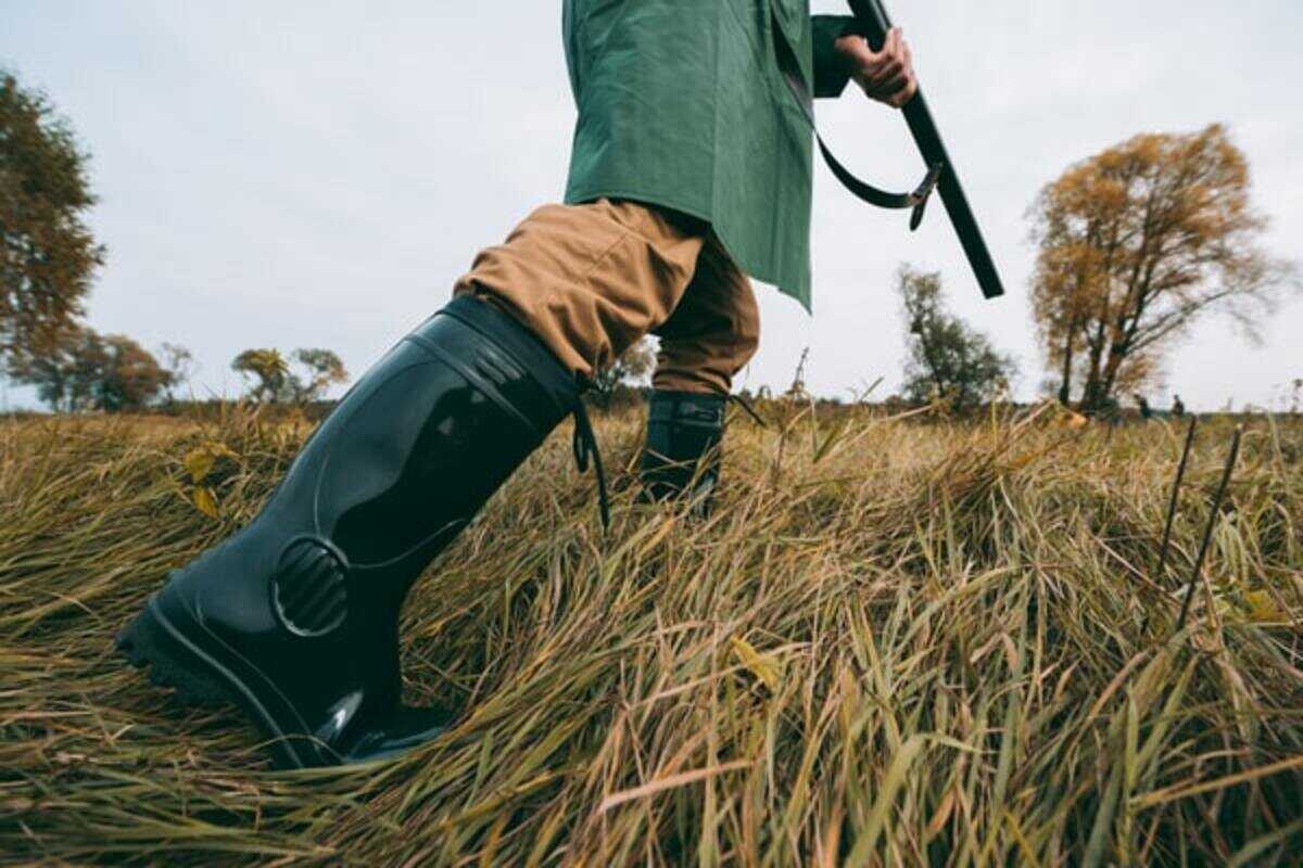 Man in Quality Hunting Boots in the Field 
