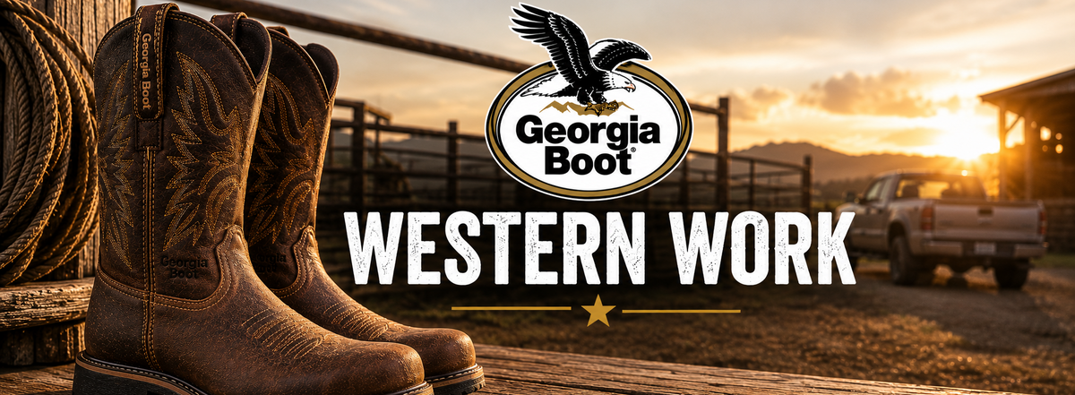 A pair of brown western boots displayed on a wooden fence at sunset, with a pickup truck and mountains in the background. The Georgia Boot logo and the words 'WESTERN WORK' are overlaid prominently in the center.
