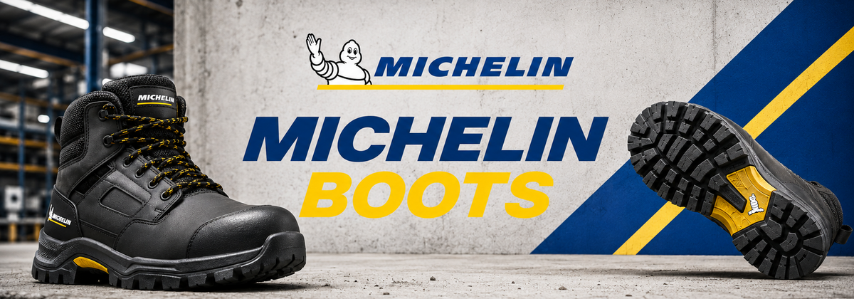 A pair of Michelin boots shown in a promotional industrial setting, with one boot standing upright on the left and the sole of another boot displayed on the right. Large text reads 'MICHELIN MICHELIN BOOTS' with the Michelin logo, and the background is a textured gray wall with blue and yellow graphic elements.